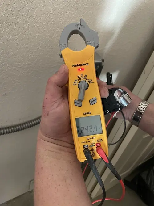 Voltage testing with clamp meter during Ceiling Fan Installation in Bay St. Louis